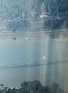 Banihal Blaze: IAF Helicopter With ‘Bambi Bucket’ Deployed in Dal Lake To Facilitate Firefighting Operation