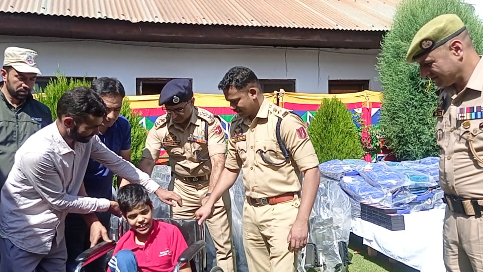 Ganderbal Police distributes wheel chairs among specially-abled persons and stationary items among needy students